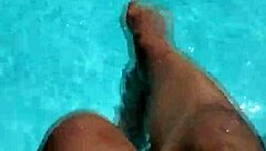 Young man's solo pool play with foot fetish twist
