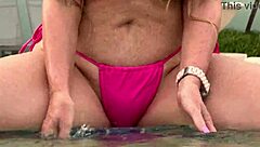 hot milf shows wet shaved pussy in public tub