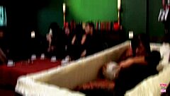 A brunette's funeral turns into a group gathering with costumes and tattoos.