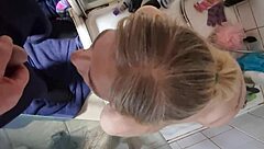 A blonde woman consumes urine and performs oral sex on a man