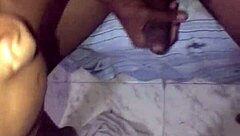 A talented man with a big black cock gives a blowjob outdoors