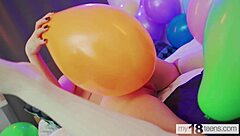 My18teen girl with big tits plays nude with balloons