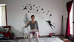 mature wife teaches yoga lesson with instructions