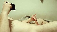 Solo session with petite package and porn viewing leads to explosive climax