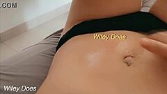 Wife fingers her shaved pussy passionately