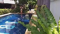 Girl fucks black dildo in public pool