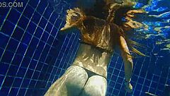 Girl fucks black dildo in public pool