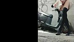 Chinese shemale masturbates outdoors, shooting cum in wild exposure scene.