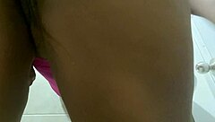 Latina beauty in the bathroom: A hidden camera captures her big ass and big tits