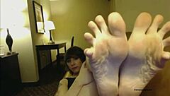 sexy emo transsexual teases with her feet on webcam, showing her cock