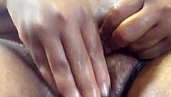 Alundra's big ebony pussy gets a satisfying rub and squirt