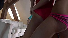Seductive women in their living room engage in yoga and fitness exercises to reveal their breasts during a clothing exchange party.