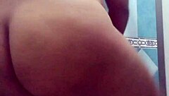 Pregnant Mexican Filipina woman showers after beach in voyeur video