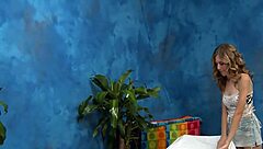 Massage session with oiled body and intense pressure