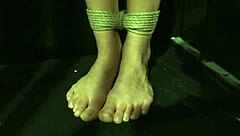 bound sub endures punishment from lezdom