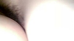 Owner interacts with a tall top in vietnamese setting