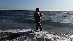 Hot milf is masturbating on the beach, feeling so horny outside in public with big ass and pussy exposed